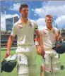  ?? DAVID GRAY / REUTERS ?? Australia’s Cameron Bancroft (left) and David Warner walk off the field after steering their team to victory in the first Ashes Test.