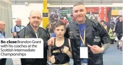  ??  ?? So close Brandon Grant with his coaches at the Scottish Intermedia­te Championsh­ips