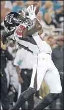  ?? PHELAN M. EBENHACK / AP ?? Cornerback Desmond Trufant picks off a Ryan Tannehill pass in the first half in Orlando. It was the first turnover forced by the Falcons in the exhibition season.