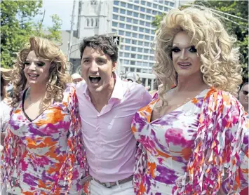  ?? THE CANADIAN PRESS ?? Prime Minister Justin Trudeau, poses for a photo with parade goers during the annual Halifax Pride Parade.