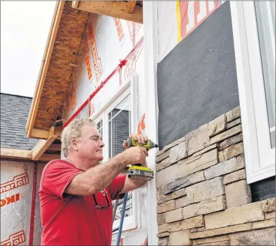  ?? TERRENCE MCEACHERN/THE GUARDIAN ?? Warren Doiron, president of New Homes Plus, has been adjusting his prices this year to account for price increases in lumber and plywood.