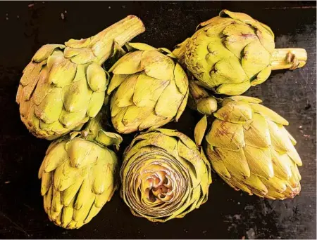  ?? GRETCHEN MCKAY/PITTSBURGH POST-GAZETTE PHOTOS ?? Artichokes are very easy to cook and have tender, flavorful leaves. The peak season is March to May.