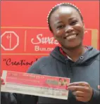  ?? ?? SBS’s Nosipho Maphalala of Operations smiles as she reveals a winner.