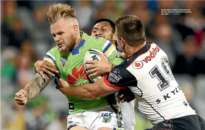  ?? GETTY IMAGES ?? Raider Blake Austin charges the ball into the Warriors defence in Canberra last night.