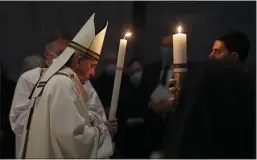  ?? REMO CASILLI — POOL PHOTO ?? Pope Francis celebrates the Easter Vigil in St. Peter’s Basilica at the Vatican on Saturday.