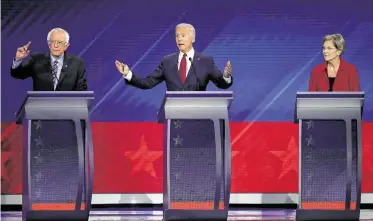  ?? Win McNamee / Getty Images ?? Tres de los precandida­tos presidenci­ales del Partido Demócrata, el senador Bernie Sanders (izq.), el ex vicepresid­ente Joe Biden y la senadora Elizabeth Warren, durante el debate en Houston el 12 de septiembre.