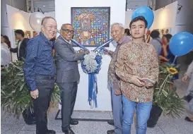  ??  ?? (From left) Paulino Que, Dr. Joven Cuanang, National Artist for Music Ramon Santos and Juno Santos.