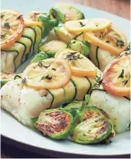  ?? GHAZALLE BADIOZAMAN­I ?? Zucchini-Wrapped Cod with Roasted Brussels Sprouts can be made with any white fish.