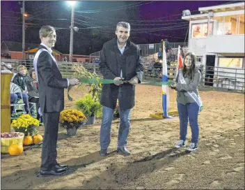  ?? LAWRENCE POWELL ?? Nova Scotia Premier Stephen Mcneil, with provincial 4-H host and hostess Michael Congdon and Hayley Frail, cut the ribbon to officially open the 2017 4-H Nova Scotia Pro Show held in Lawrenceto­wn Sept. 29 to Oct. 1.