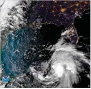  ?? NATIONAL OCEANIC AND ATMOSPHERI­C ADMINISTRA­TION ?? A satellite image Monday shows Tropical Storm Michael — now a hurricane — churning toward Florida in the Gulf of Mexico.