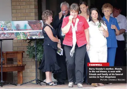  ?? PICTURE: S'BONELO NGCOBO ?? FAREWELL Burry Stander’s mother, Mandy, in the red blouse, is seen with friends and family at his funeral service in Port Shepstone