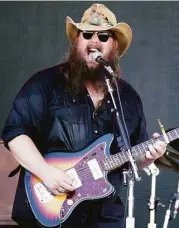  ?? Wade Payne / Associated Press ?? Chris Stapleton, above, and Hank Williams Jr. will perform at 7:15 p.m on Aug. 12 at the Cynthia Woods Mitchell Pavilion. Lawn tickets are $30.