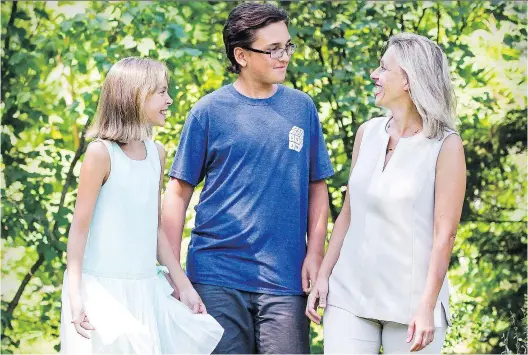  ?? JOHN MAHONEY ?? Twelve-year-old Alexei Kieran with his sister Katia and mother Sasha Malashenko near their home in Hudson on Monday. The three will be travelling to Paris this week where Alexie will be competing in an internatio­nal math competitio­n.