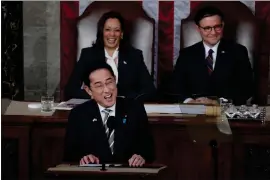  ?? JACQUELYN MARTIN - THE ASSOCIATED PRESS ?? Japan’s Prime Minister Fumio Kishida addresses a joint meeting of Congress in the House chamber Thursday, accompanie­d by Vice President Kamala Harris and Speaker of the House Mike Johnson, R-LA.