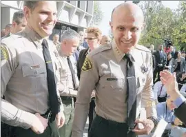  ?? Mark Boster
Los Angeles Times ?? JAMES HELLMOLD, left, was promoted quickly after serving as Sheriff Lee Baca’s driver. The day after Baca retired, however, Hellmold was demoted.