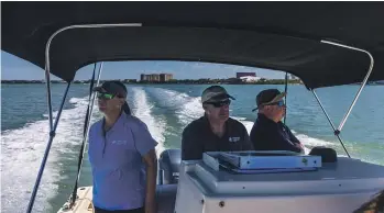  ?? ?? Sarasota Dolphin Research Program director Randy Wells, centre, with deputy program director Katie McHugh, left, and lab manager Jason Allen in Florida’s Sarasota
Bay. SAUL MARTINEZ/THE WASHINGTON POST