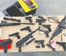  ??  ?? Vancouver police display an extensive collection of fake guns that had been seized during the first six months of the year.