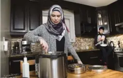  ?? BERNARD WEIL/TORONTO STAR ?? Uzma Jalaluddin, who is re-examining her shopping habits, says the Instant Pot she purchased recently will be her last new kitchen gadget for a long time.