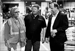  ??  ?? Sen. Claire McCaskill, D-Mo., tours the plant with executives Chris Pratt, center, and George Skarich in Poplar Bluff. The company has eliminated positions and idled a plant.