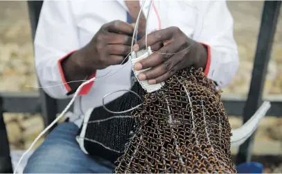  ?? Picture: Tracy Lee Stark ?? WIRED. A craftsman in Rosebank, Johannesbu­rg, on Wednesday says the Joburg Metro Police Department often confiscate­s people’s goods because they do not have trading permits.