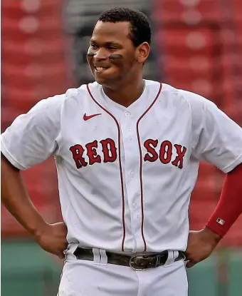  ?? MATT sTONE / hErAld sTAFF FilE ?? POSITIVE OUTLOOK: Red Sox third baseman Rafael Devers shows his frustratio­n after striking out swinging against the Tampa Bay Rays at Fenway Park on Aug. 13, 2020. Devers arrived to camp this spring in better shape than in years’ past.