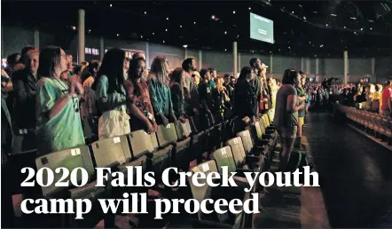  ?? [THE OKLAHOMAN ARCHIVES] ?? Members of a youth group sing during a 2019 evening worship at Falls Creek Baptist Conference Center in Davis.