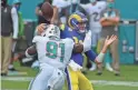  ?? JASEN VINLOVE/USA TODAY SPORTS ?? Dolphins defensive end Emmanuel Ogbah forces a fumble with a hit on Rams quarterbac­k Jared Goff on Nov. 1.