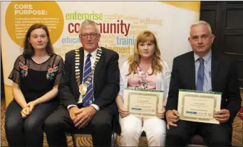  ??  ?? The family of Patsie Jones RIP receive her certificat­e at the awards presentati­on. From left – Ciara Jones, Cllr Willie Fitzharris, Julie Barden, who made the presentati­on, and Eamon Jones.