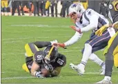  ?? / Don Wright, File) ?? Pittsburgh Steelers tight end Jesse James (81) loses his grip on the football after crossing the goal line on a pass play against the New England Patriots in the closing seconds of the fourth quarter of an NFL football game in Pittsburgh in December....