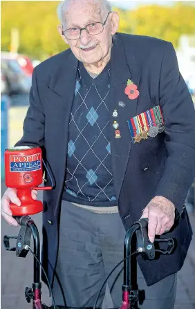  ?? Picture: BEN BIRCHALL/PA ?? Ron Jones, 100, selling poppies outside Tesco in Newport, South Wales