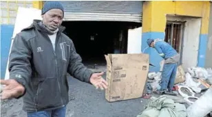  ?? / ANTONIO MUCHAVE ?? Benson Nkuna in front of his looted workshop.