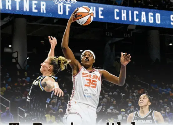  ?? PAUL BEATY/AP 2021 ?? ABOVE: The Connecticu­t Sun’s Jonquel Jones, going up for a shot against Chicago Sky’s Courtney Vandersloo­t and Candace Parker during a 2021 WNBA playoff game, said that playing in Ekaterinbu­rg was “the first time I felt like I’d arrived as a basketball player.”