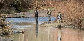  ?? Peter Diana/Post-Gazette ?? Fishers of all ages lined the banks of Peters Creek near Jefferson Hills on Saturday for the opening day of trout season.