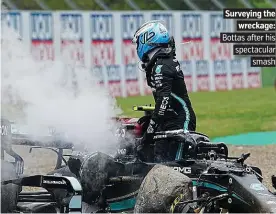  ?? PICTURE: REX ?? Surveying the wreckage: Bottas after his spectacula­r smash