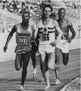  ??  ?? Jamaica’s George Kerr (No 227) forges ahead of England’s G. Varah and went on to win his heat in 1.52.3 secs in the 880 yards. At right is Trinidad’s B. Cayenle, who was second in the heat. Kerr went on to clock 1.47.7 in the semi-final.