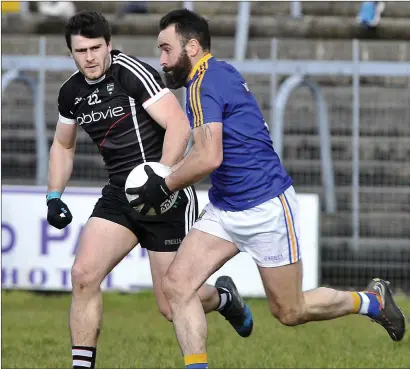  ??  ?? Pat Hughes of Sligo in action with Longford’s Diarmuid Masterson in their Allianz Division 3 Rd 5 match in Markievicz Park on Sunday. Pics: Tom Callanan.