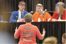  ?? RICH PEDRONCELL­I/ASSOCIATED PRESS ?? Jane Carson-Sandler, a 1976 rape victim of Golden State Killer Joseph James DeAngelo, supports a prosecutor’s statement during a court hearing in Sacramento, Calif.