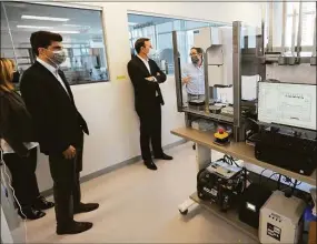  ?? Hearst Connecticu­t Media file photo ?? State Rep. Matt Blumenthal, D-Stamford, left, and Sen. Chris Murphy, D-Conn., tour Sema4’s laboratory at 62 Southfield Ave., in Stamford in 2020. Sema4 announced this week the completion of its acquisitio­n of another testing provider, GeneDx, whose
chief executive officer will now lead Sema4.