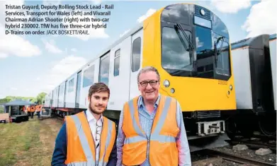  ?? JACK BOSKETT/ RAIL. ?? Tristan Guyard, Deputy Rolling Stock Lead - Rail Services, Transport for Wales (left) and Vivarail Chairman Adrian Shooter (right) with two-car hybrid 230002. TfW has five three-car hybrid D-Trains on order.