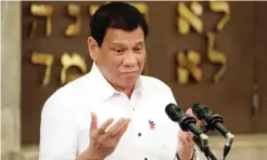  ??  ?? MANILA: Philippine President Rodrigo Duterte gestures during his speech at the Beit Yaacov Synagogue, The Jewish Associatio­n of the Philippine­s in Makati, south of Manila on Tuesday. — AFP