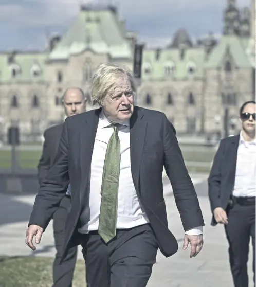  ?? ?? Boris Johnson makes his way towards West Block on Parliament Hill in Ottawa to give a speech at the Canada Strong and Free Networking Conference