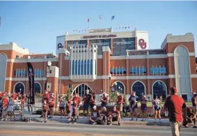  ?? BRYAN TERRY/THE OKLAHOMAN ?? Fans wait outside Gaylord Family-Oklahoma Memorial Stadium before OU’s game against Nebraska last Saturday.