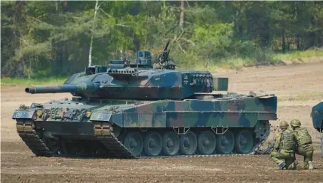  ?? PATRIK STOLLARZ/GETTY-AFP 2019 ?? A Leopard 2 tank takes part in practice at a military training area in northwest Germany.