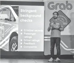  ??  ?? GRAB SAFETY — Grab Country Head Brian Cu unveils yesterday in Libis, Quezon City the ride-hailing app’s ‘Safer Everyday Tech Roadmap’ in a bid to raise the level of transport safety standards. (Kevin Tristan Espiritu)