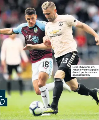  ??  ?? Luke Shaw and, left, Antonio Valencia put in decent performanc­es against Burnley