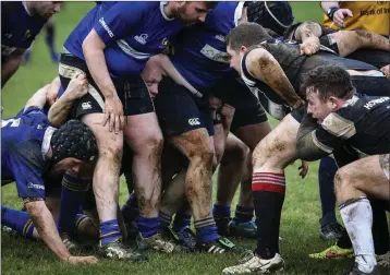  ??  ?? Rathdrum’s Danny Dowling wins a lineout at the 43rd annual charity Houndogs rugby match in Rathdrum. Rathdrum scrum down against the Houndogs.