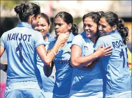  ?? AFP ?? Indian women’s hockey team players celebrate after scoring the opening goal against England on Sunday. India registered an upset 21 win over the world No 2 side.