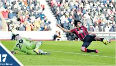  ??  ?? Key strike: Nathan Ake slams in Bournemout­h’s second goal