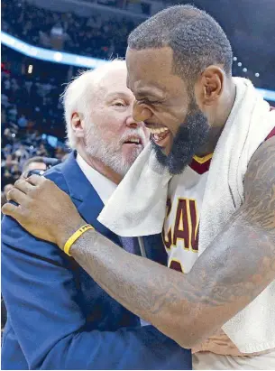  ?? AFP ?? LeBron James of the Cleveland Cavaliers shares a light moment with head coach Gregg Popovich of the San Antonio Spurs at the end of their game where the Cavs main man makes the 30,000-point record.