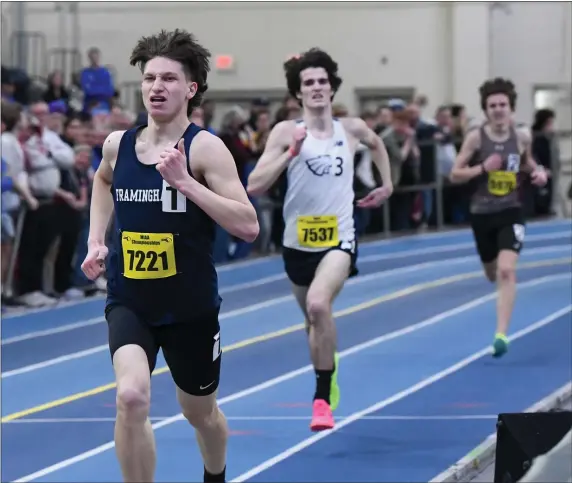  ?? PHOTO BY JIM MAHONEY — MEDIANEWS GROUP/BOSTON HERALD ?? Framingham High’s Sam Brugess pulled away from St. John’s Prep Natahn Lopez and Paul Bergeron to take the 2-mile run.